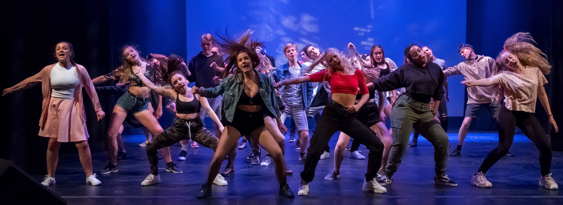teens performing a musical theatre sing and dance routine