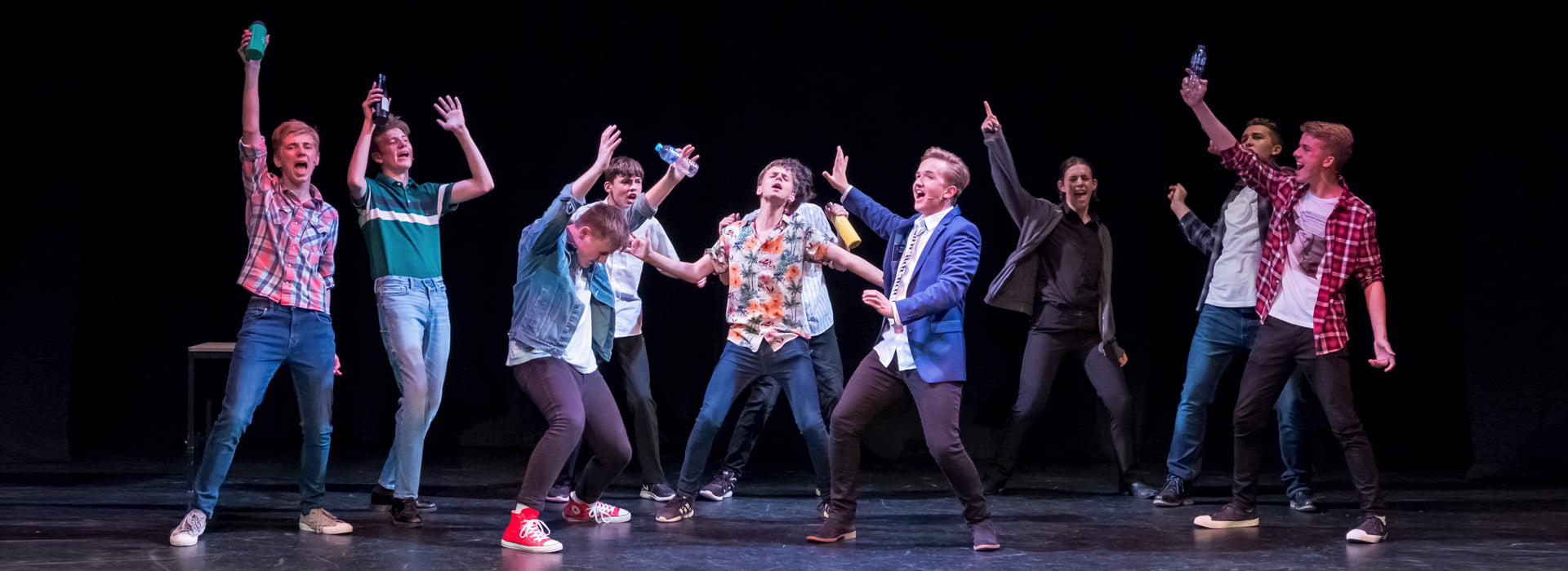 teen boys group sing and act musical theatre